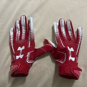 Red and white under armor peewee football gloves